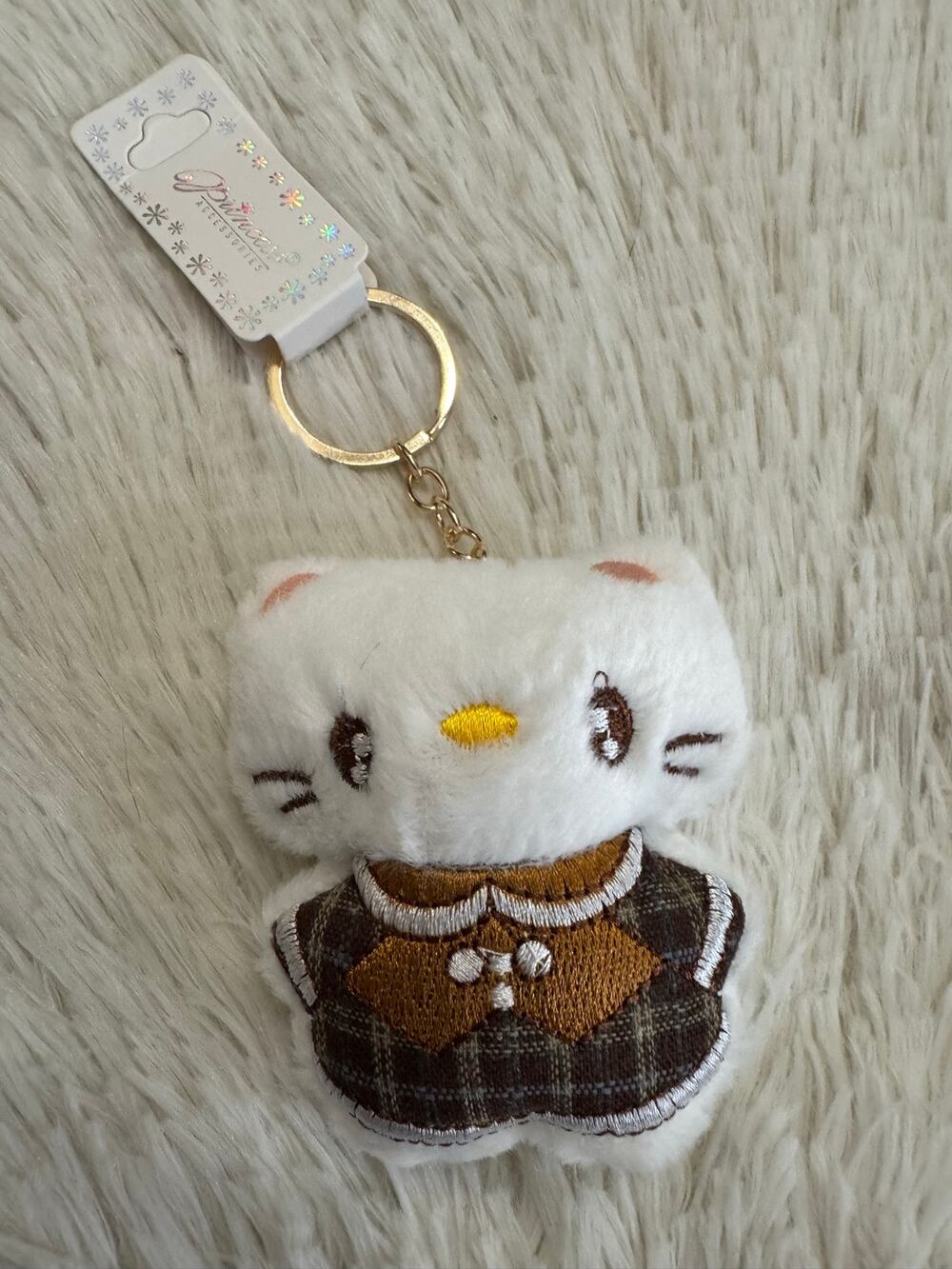 Hello Kitty white plush embroidered keychain with brown plaid skirt & beige bow